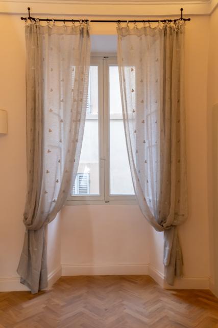 Window with linen curtains