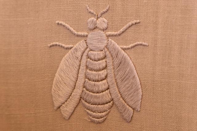 The embroidered bee, the house emblem
