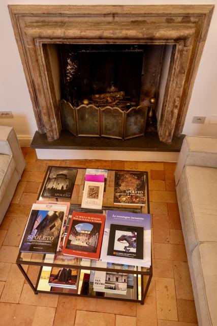 Books on Spoleto by the fireplace